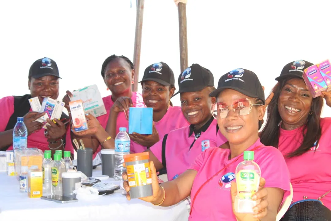 Volunteers holding medicines and supplies at the medical outreach